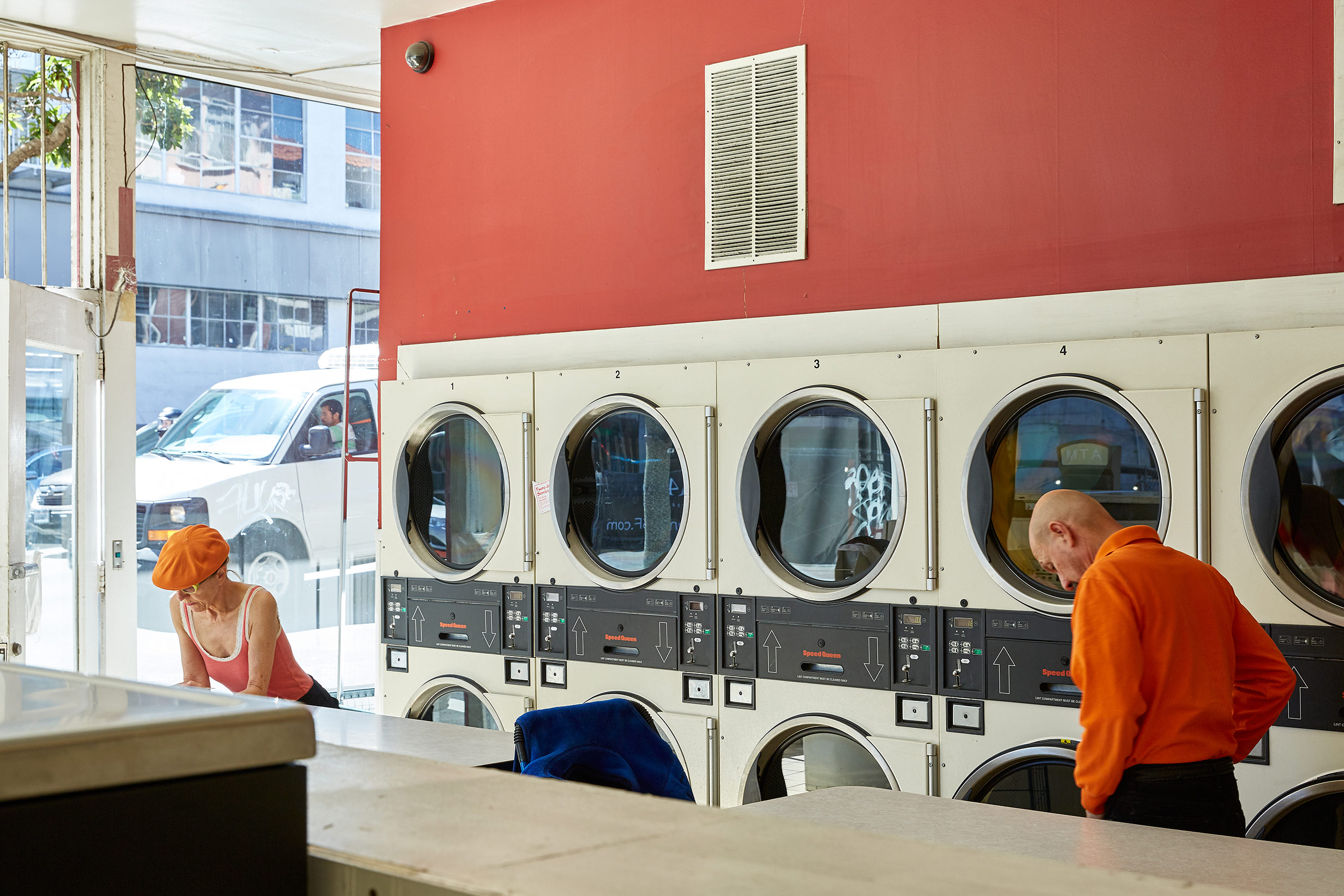 laundry with two people in orange in Miami