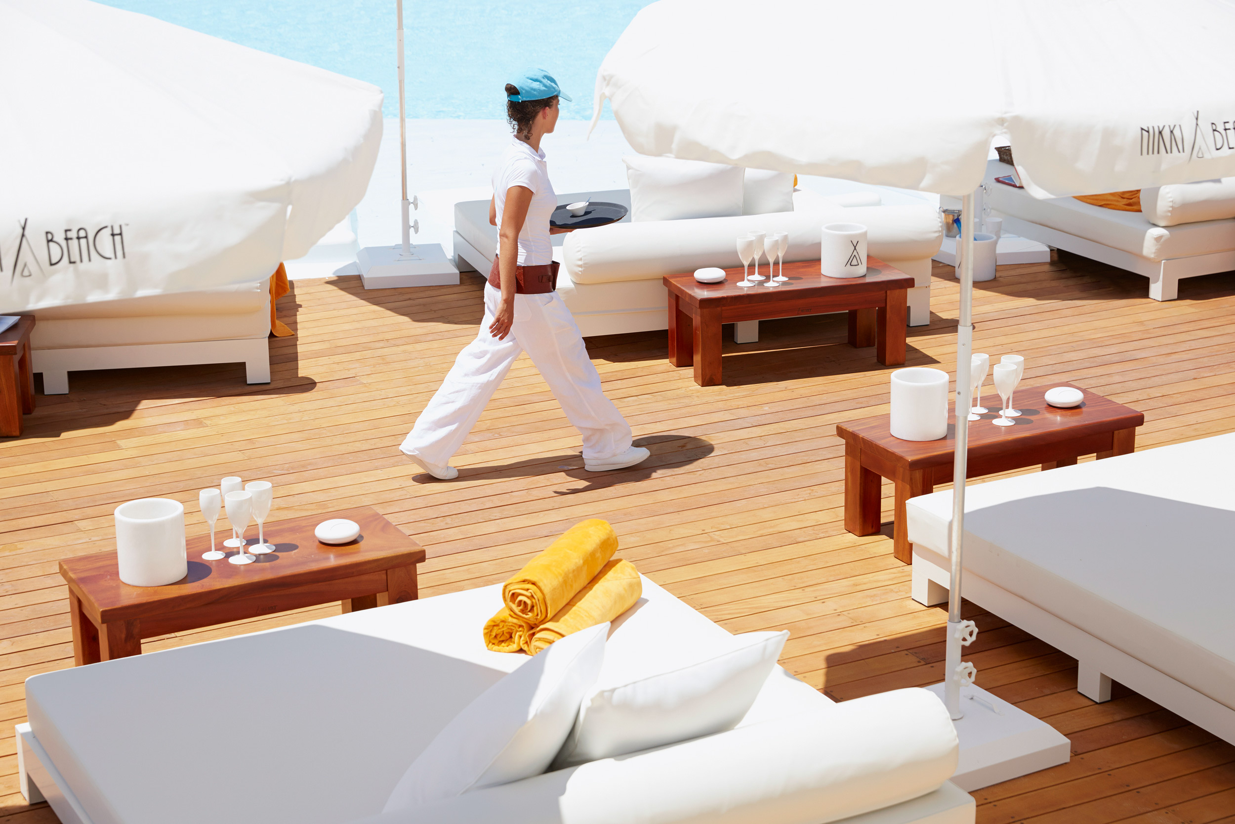 Nikki Beach Porto Heli, waitress at main pool walking