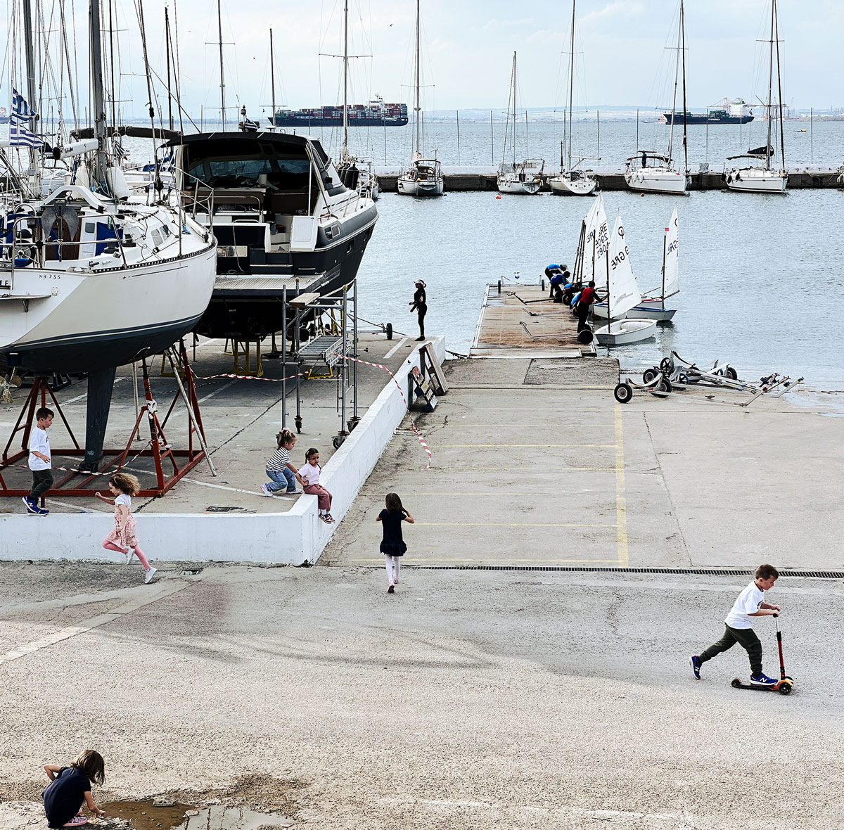 kids playing in a sailing marina, Thessaloniki