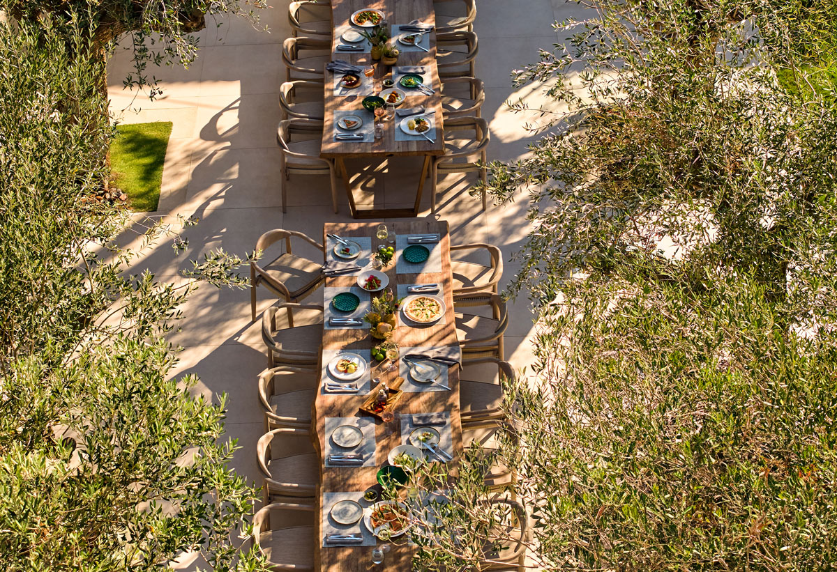 Ikos Porto Petro long table with dishes , bird's view