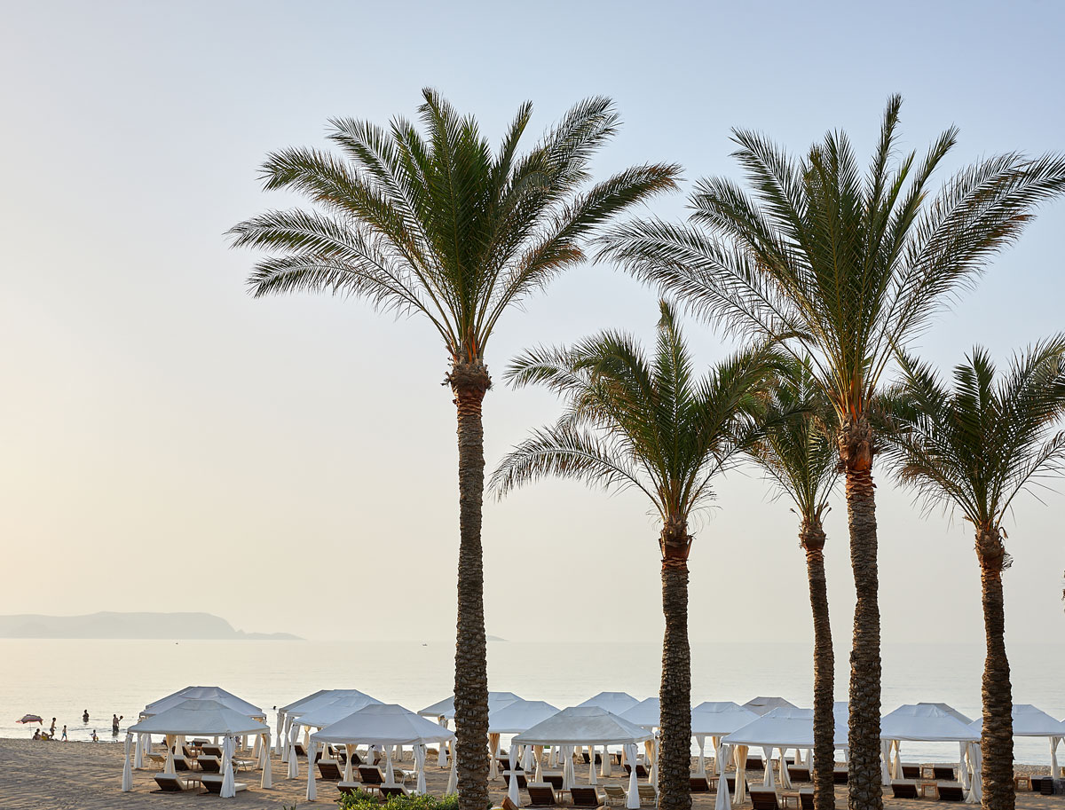 Grecotel Amirandes, beach , gazebos , palm trees, afternoon sunlighthttps://www.anestismichalis.com/