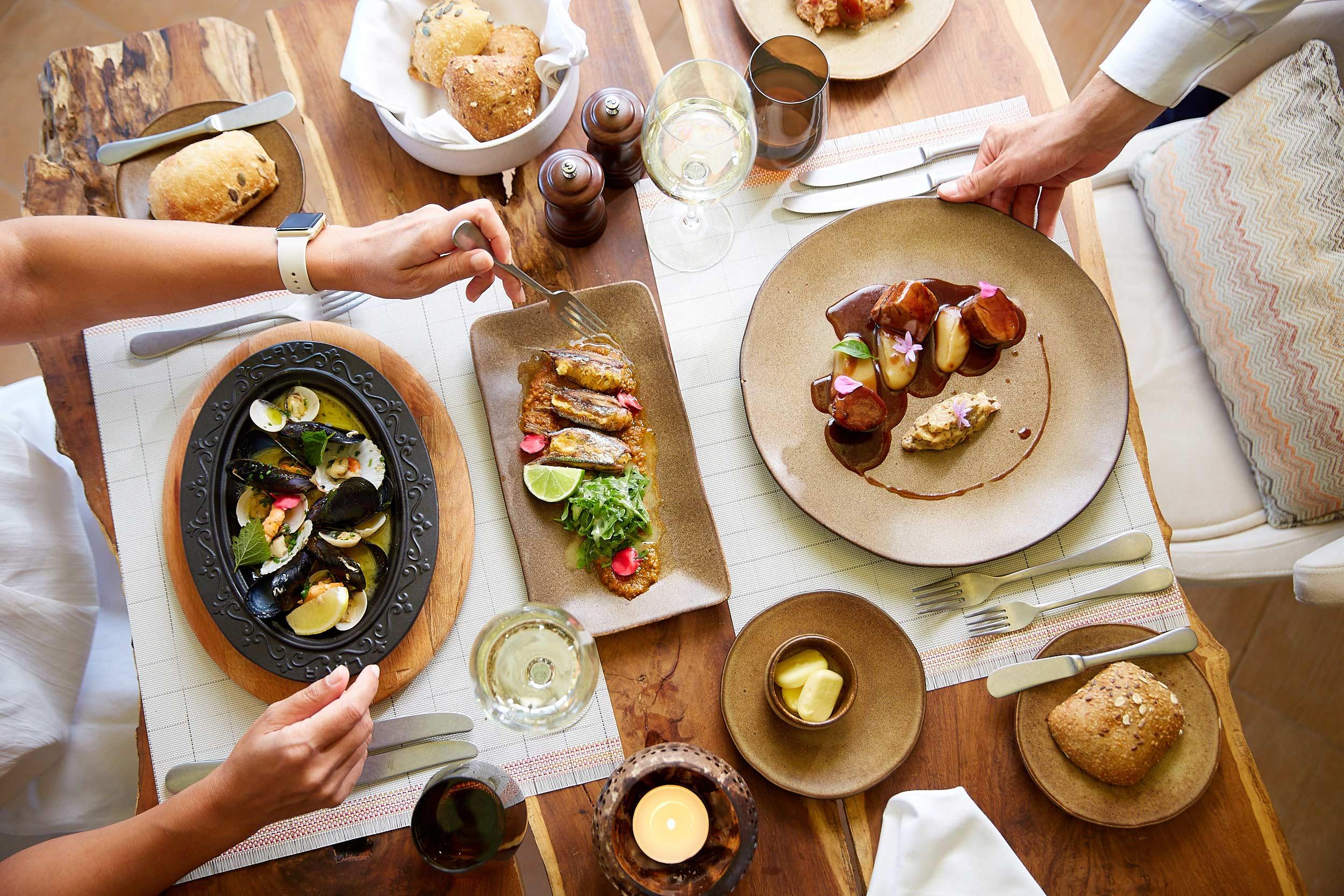 top view on table and plates with client, Ikos Dassia, Corfu