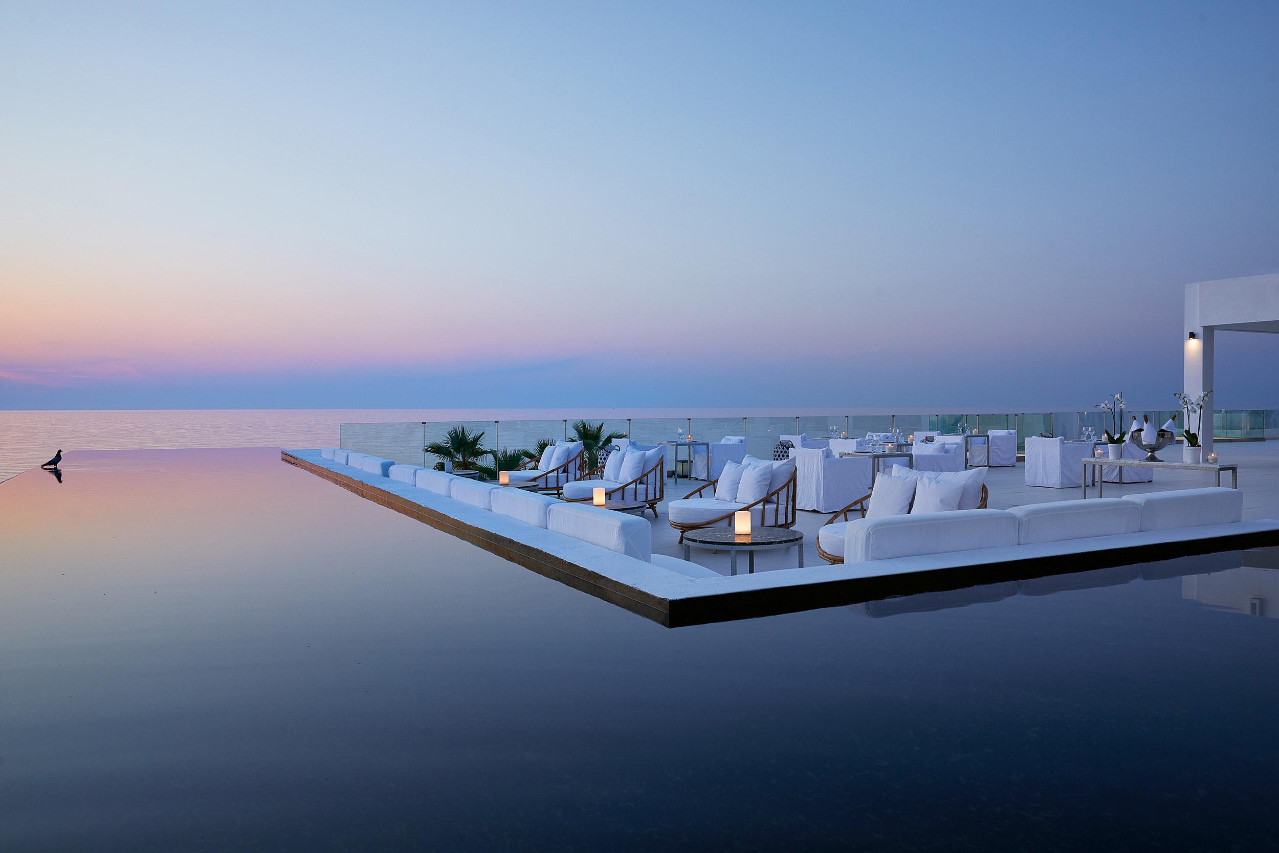 Grecotel Lux Me White Palace, bar restaurant , infinity lagoon , sunset