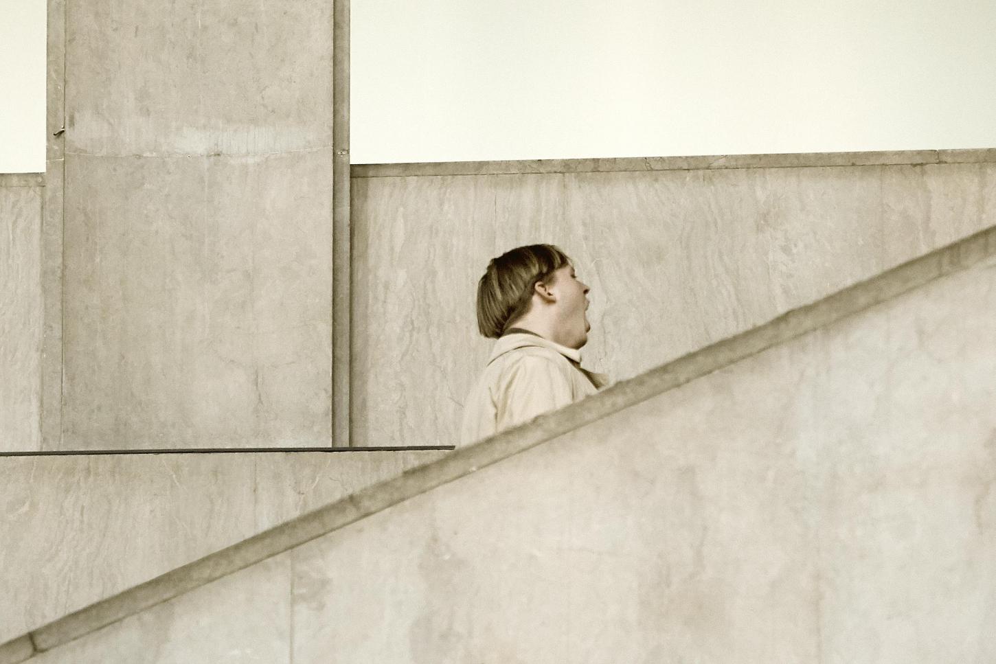 Man with open mouth at stairs, Palais de Tokyo, Paris