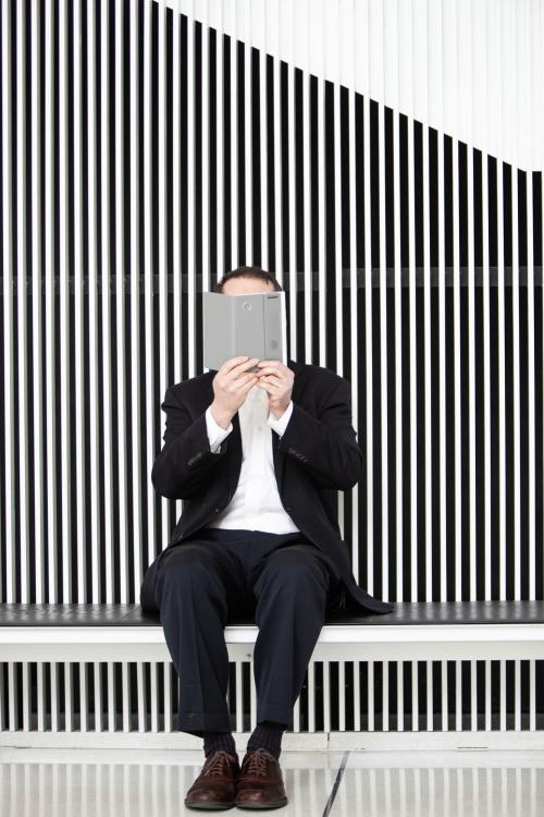 Joseph M. Jacobson at MIT with e-book in front of his face