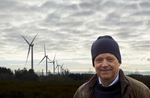 Henrik Stiesdal in front of wind turbines 