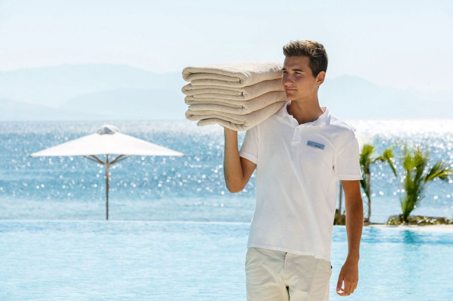 pool boy with towels Ikos Dassia