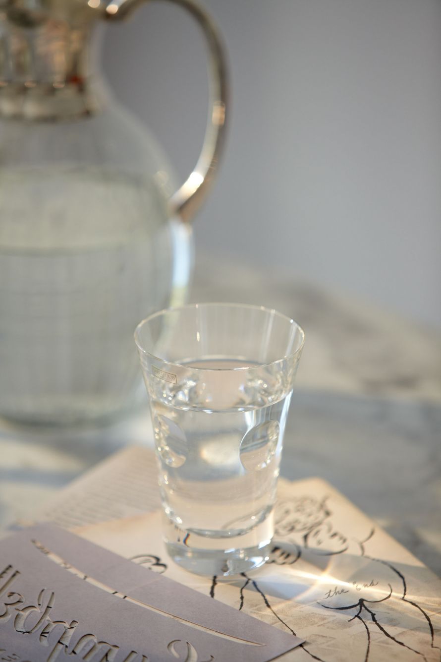 detail of water carafe and glass at Danai Beach, Greece