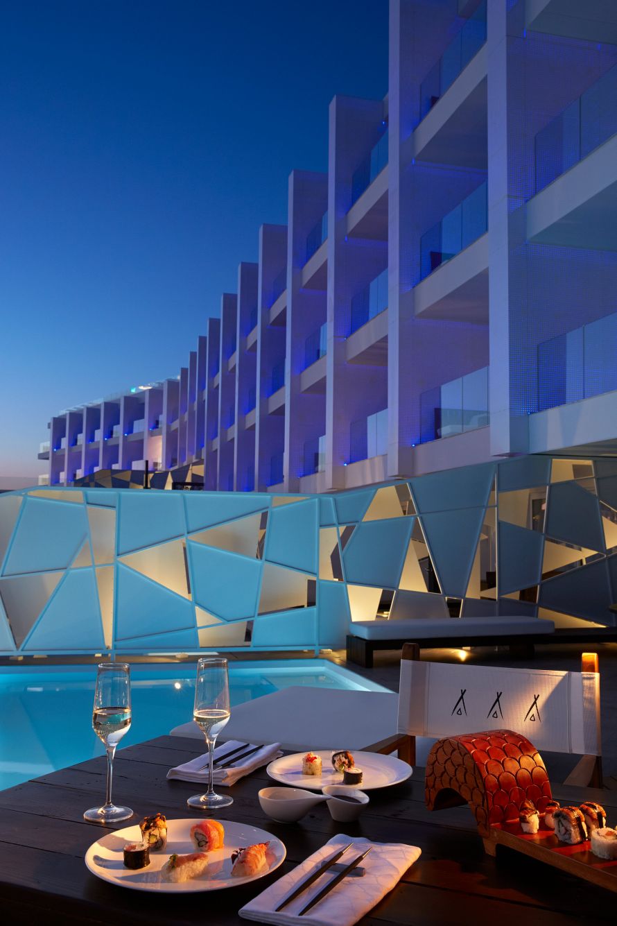 Nikki Beach Porto Heli, romantic asian diner set up in front of the lit building