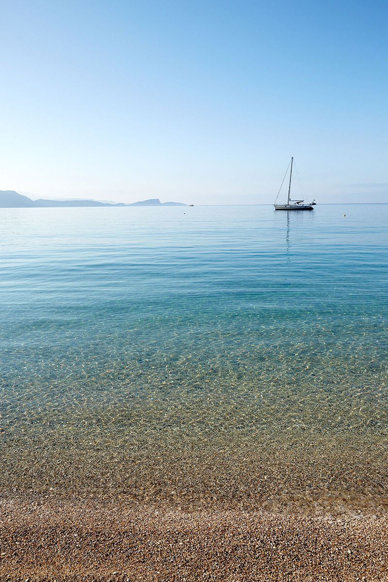 Lichnos Beach with sailing boat