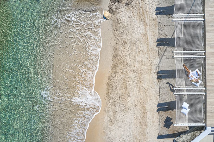 Grecotel Lux Me White Palace, aerial view, woman in hammock 