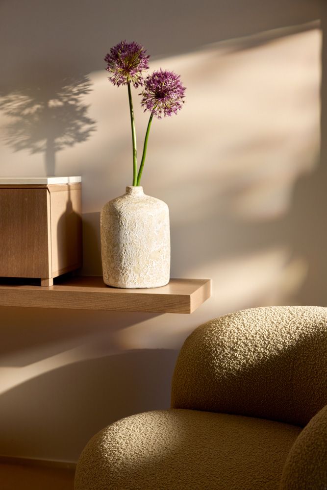 Sani Asterias Villas, detail with purple flower and sunlight
